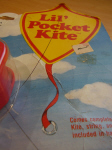 Kite with weighted tail on package 